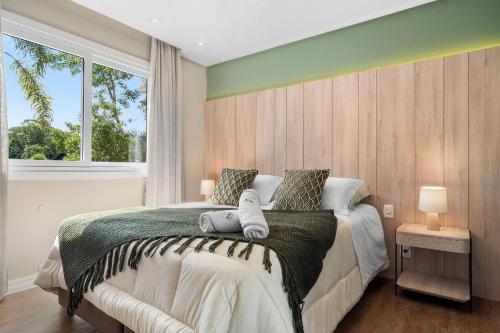 Postel nebo postele na pokoji v ubytování Toscano Cabernet 2 Suítes by Achei Gramado