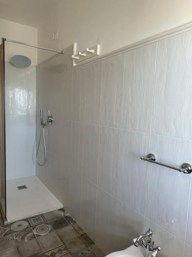 a bathroom with a shower and a toilet at AD in Capo dʼOrlando
