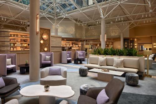 a lobby with couches and tables and chairs at The Westin DC Downtown in Washington, D.C.