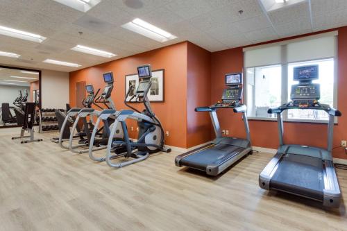 a gym with several treadmills and elliptical machines at Drury Inn & Suites Fort Myers Airport FGCU in Fort Myers