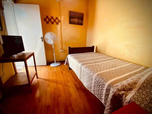 Łóżko lub łóżka w pokoju w obiekcie Residencial Italiana