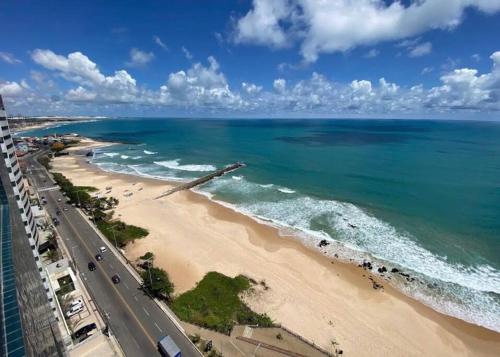 an aerial view of a beach and the ocean at Flat Alto Padrão Beira Mar in Natal