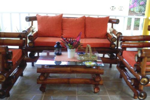 a living room with a couch and a coffee table at Coco Banana Resort Appartment 1 in Las Galeras