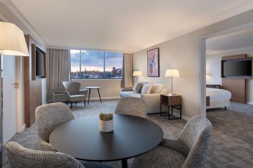 a hotel room with a table and a bed at Delta Hotels by Marriott Bristol City Centre in Bristol