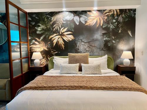 a bedroom with a large bed with a floral wall at Blu Cashmere Suite * MGM Signature 23rd FLR w/balcony strip view in Las Vegas