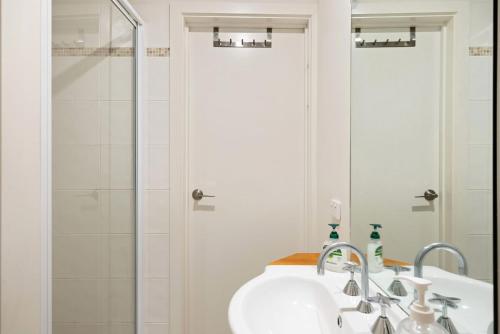 a bathroom with a sink and a shower at Petite Retreat in Cape Paterson