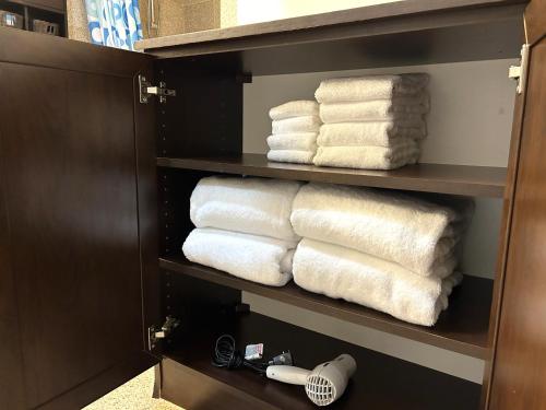 a towel rack with towels in a bathroom at Ilikai Apt 2127 - Spacious Studio with Spectacular Ocean & Harbor Views in Honolulu