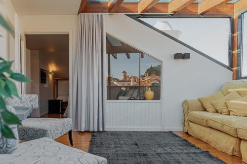 Uma área de estar em Hotel Casa da Nora