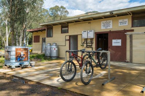 a bike parked in front of a building at Bright Cabin Park in Bright