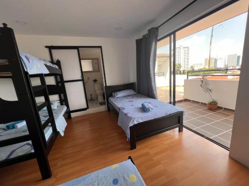 Postel nebo postele na pokoji v ubytování Epifania Hostel