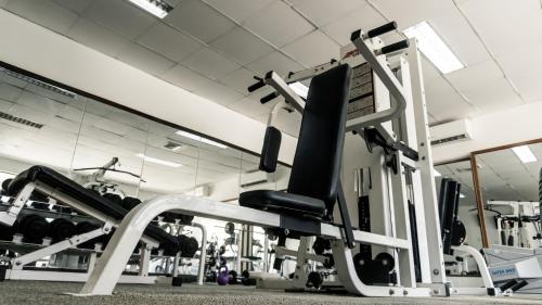 a gym with several tread machines in a room at LAOTEL VIENTIANE in Vientiane