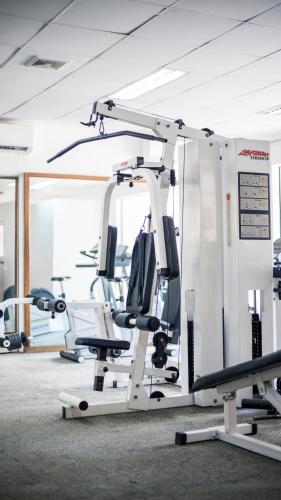 a gym with cardio equipment in a room at LAOTEL VIENTIANE in Vientiane