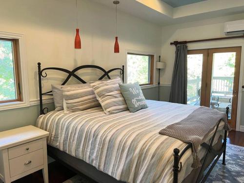 a bedroom with a large bed with pillows on it at Emerald Shores in Coloma
