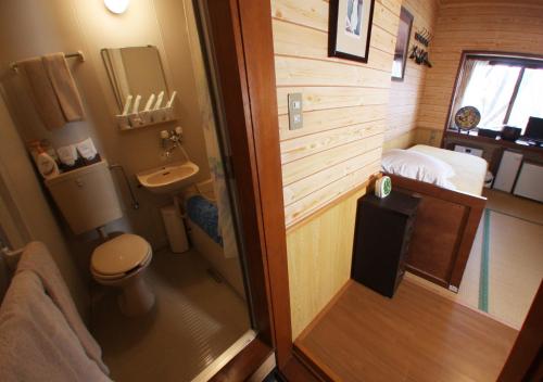 a small bathroom with a toilet and a sink at Nikko - House - Vacation STAY 96256v in Nikko