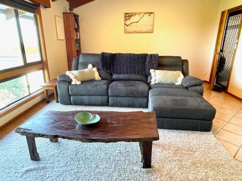 a living room with a couch and a coffee table at Cooinda Holiday Village House in American River