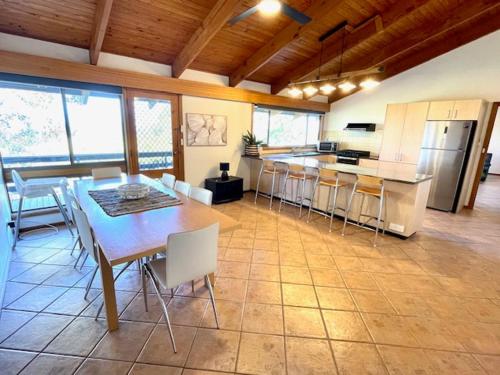 a kitchen and dining room with a table and chairs at Cooinda Holiday Village House in American River