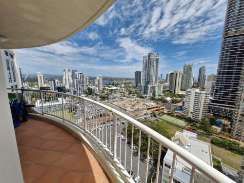 a view of a city from the balcony of a building at APR Private SUITES MOROC by the Beach in Gold Coast