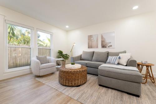 a living room with a couch and two chairs and a table at Be A Nomad 2 br Close to the Beach in Jacksonville Beach