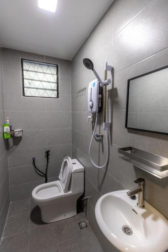 a bathroom with a toilet and a sink at -NEW- 22Pax 5R4B V KTV,KID'S POOL,POOL TABLE NEAR USM,LWE HOSPITAL,SPI ARENA in George Town