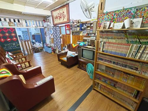 a bookstore with a room full of dvds at 鳳山79背包客 Fengshan No 79 Backpacker in Kaohsiung