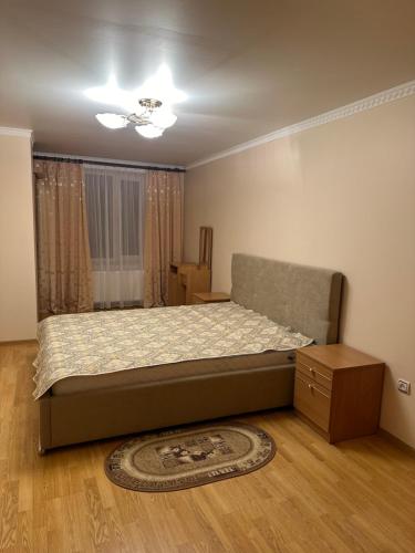 a bedroom with a bed and a dresser in it at Садиба "Джерело" in Yaremche
