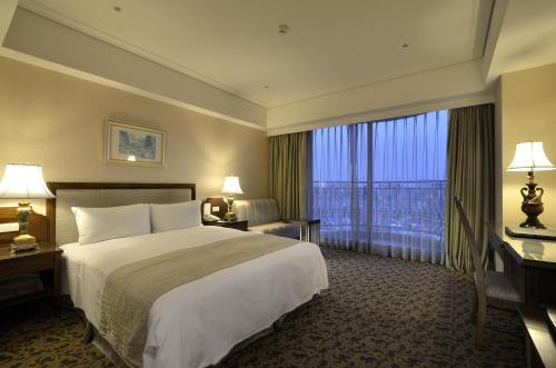 מיטה או מיטות בחדר ב-Hotel RegaLees