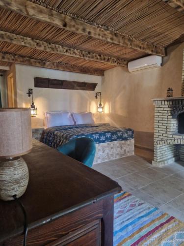 מיטה או מיטות בחדר ב-Les Bungalows d'Armelle