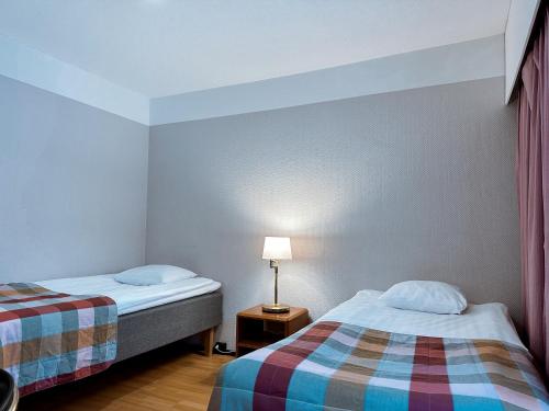 Ένα ή περισσότερα κρεβάτια σε δωμάτιο στο Hotel Sommelo