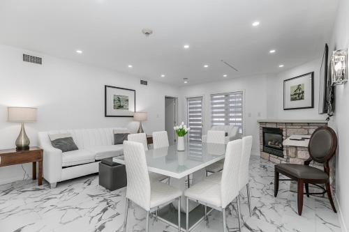 a white living room with a table and chairs at Carriage Hills Retreat Rental in Edgar