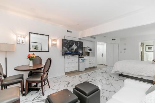 a bedroom with a bed and a table and chairs at Carriage Hills Retreat Rental in Edgar