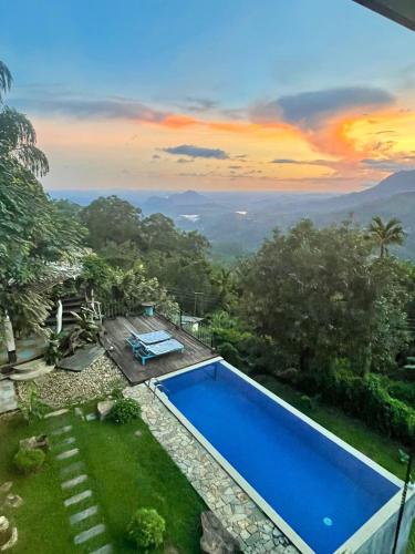 a pool in a yard with a view of the mountains at Awesome Place in Ella