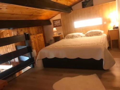 a bedroom with a large bed in a room at VENTOUX 21 in Enchastrayes