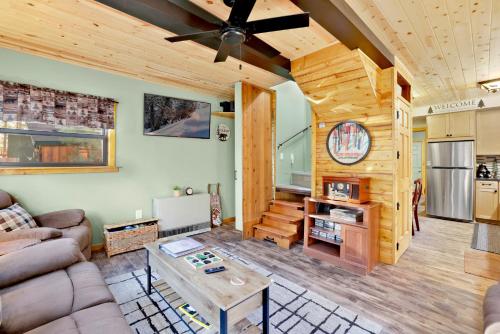 a living room with a couch and a table at 2387- Hidden Loft Chalet cabin in Big Bear City