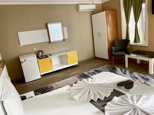 a living room with a bed and a kitchen at Airport Best Hotel in Istanbul