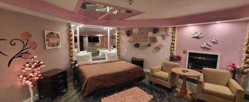 a bedroom with a bed and a living room at Inn of the Dove - Romantic Luxury Suites with Jacuzzi & Seasonal Fireplace at Harrisburg-Hershey-Philadelphia, PA in Harrisburg