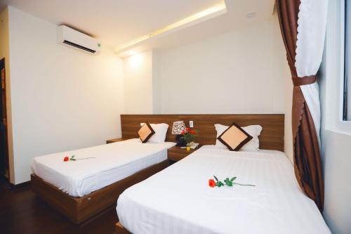 Ένα ή περισσότερα κρεβάτια σε δωμάτιο στο International Hotel