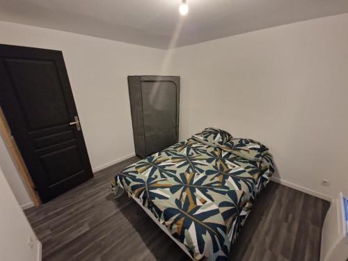 Cama ou camas em um quarto em Les Appartements Hyper Centre Maubeuge
