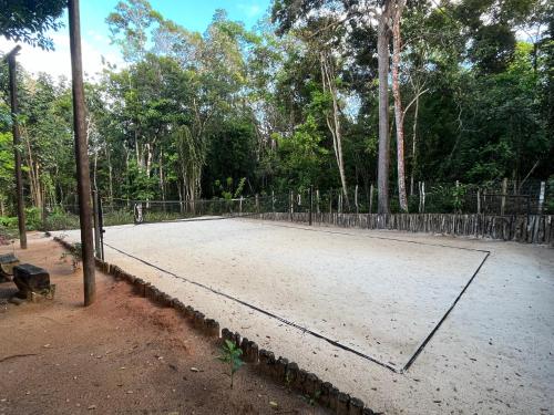 a tennis court with a net on top of it at Quinta do Sossego in Mata de Sao Joao