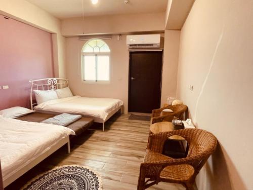 Postel nebo postele na pokoji v ubytování Lanyu IGANG Hotel