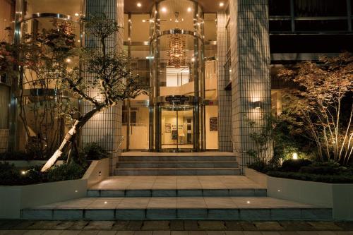 a lobby of a building at night with lights at Yokote Plaza Hotel in Yokote