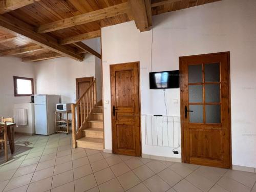 a room with two doors and a television on the wall at 6CONV20 charmante maison de village au cœur du faubourg in Collioure