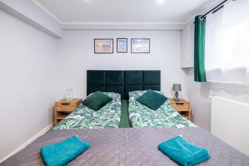 Posteľ alebo postele v izbe v ubytovaní Apartamenty Jelitkowska 13,Gdańsk Jelitkowo, 100m od morza