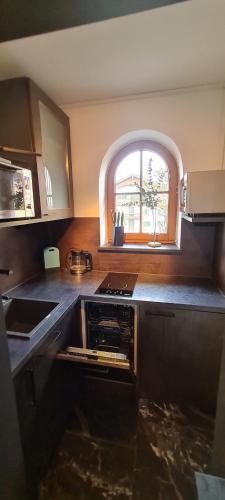 a kitchen with an open oven in the middle at Koasablick in Ebbs