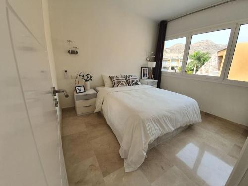 Katil atau katil-katil dalam bilik di Ocean Apartment Tauro, Fast WI-FI, Pool, Terrace