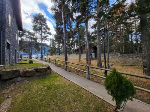 a path in a park next to a fence at Piso Acogedor en La Molina in La Molina