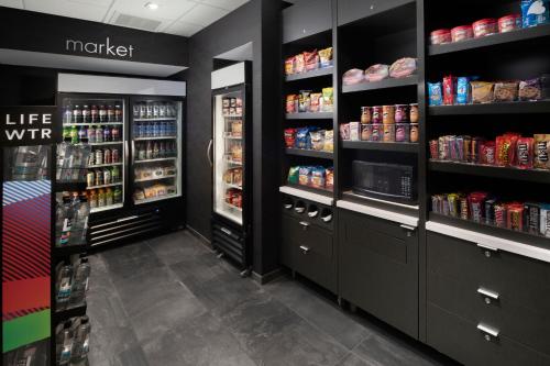 a grocery store aisle with shelves of food and drinks at Courtyard by Marriott Edina Bloomington in Bloomington