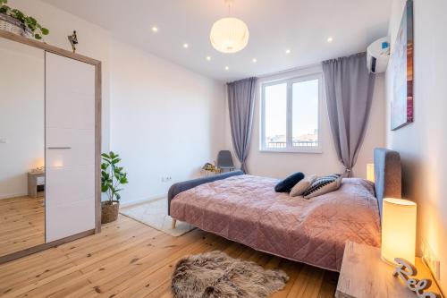 Postel nebo postele na pokoji v ubytování Bright Apartments – 2 Bedroom