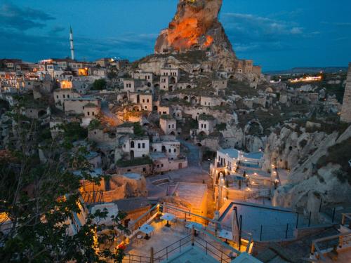 a village on a mountain at night at Vie Cappadocia - Adults Only in Nevsehir