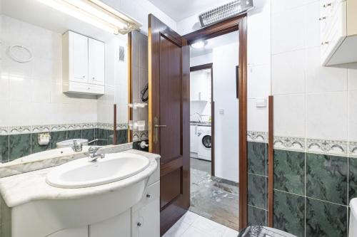 a bathroom with a sink and a shower at Benidorm Old Town 48 Apartment 2-C in Benidorm