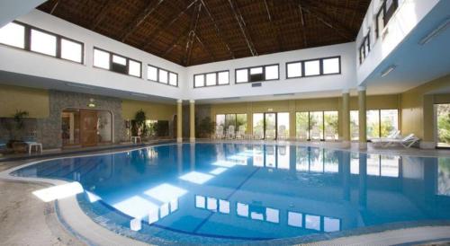 a large swimming pool in a large building at Terrace Flat with Magnificient view in Tavira